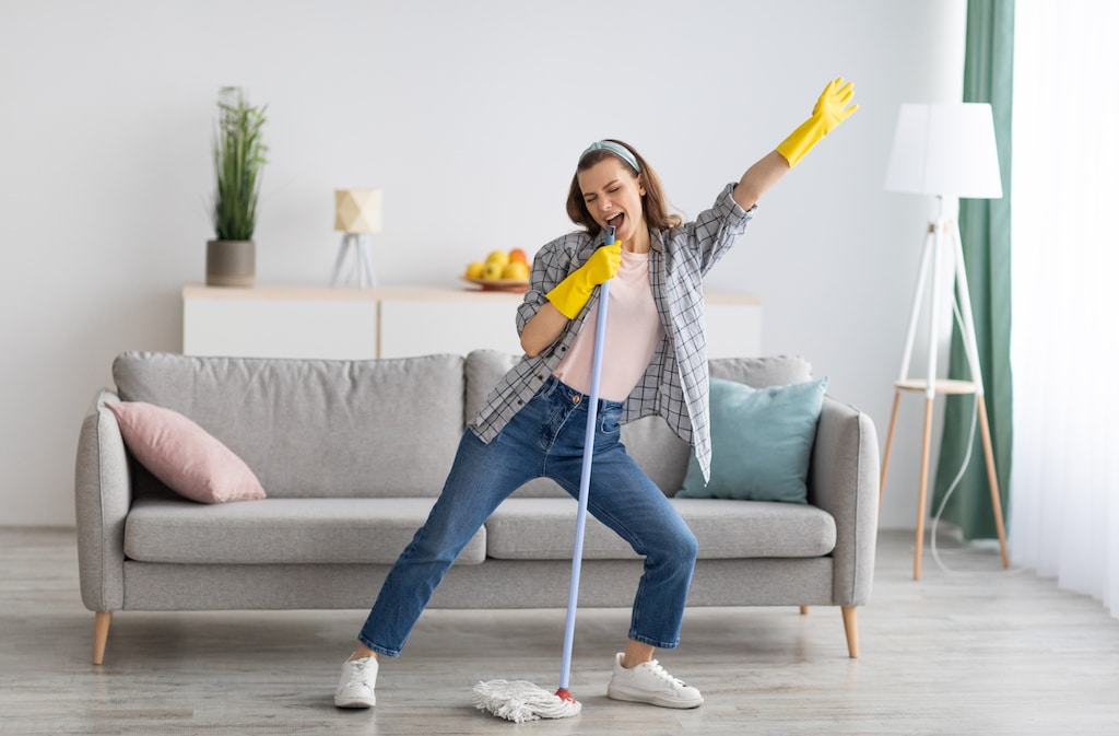 woman is cleaning an Airbnb 